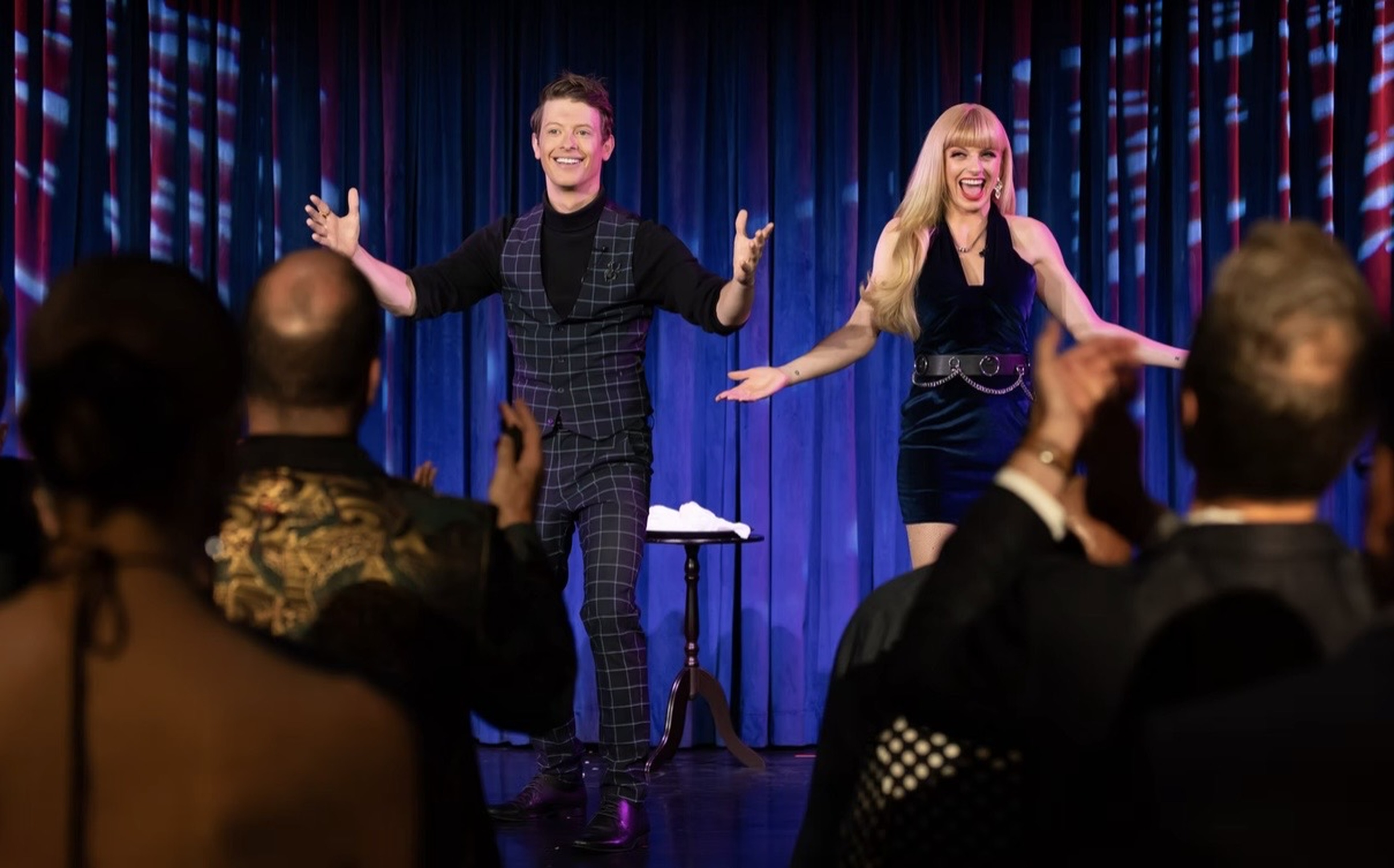 Matthew Pomeroy and Natasha Lamb greeting guests in an intimate theatre