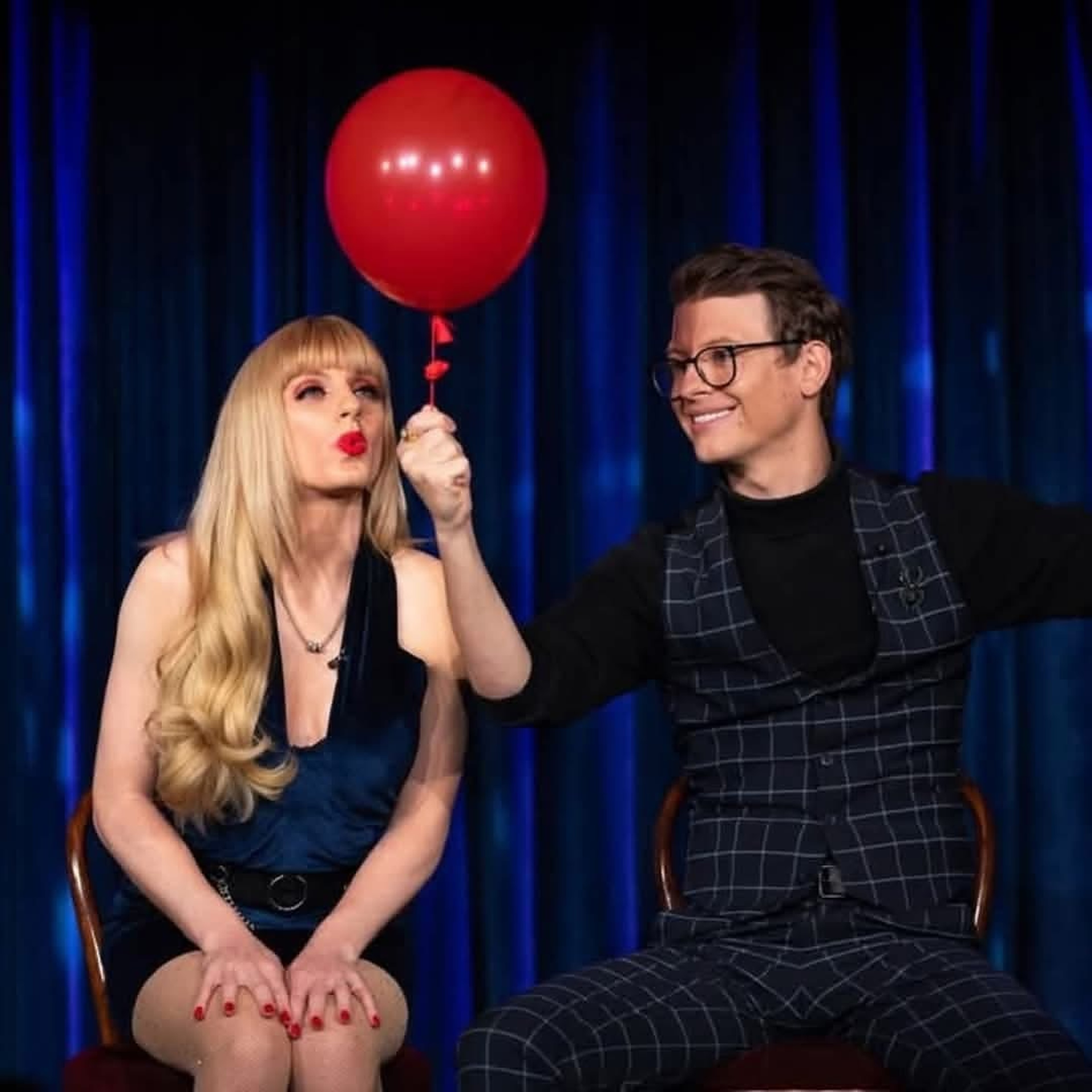 Natasha Lamb blowing a kiss to a red balloon held aloft by Matthew Pomeroy